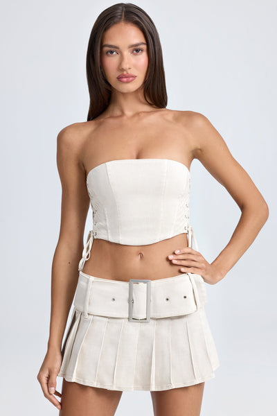 Belted Pleated Low-Rise Micro Mini Skirt in Ecru